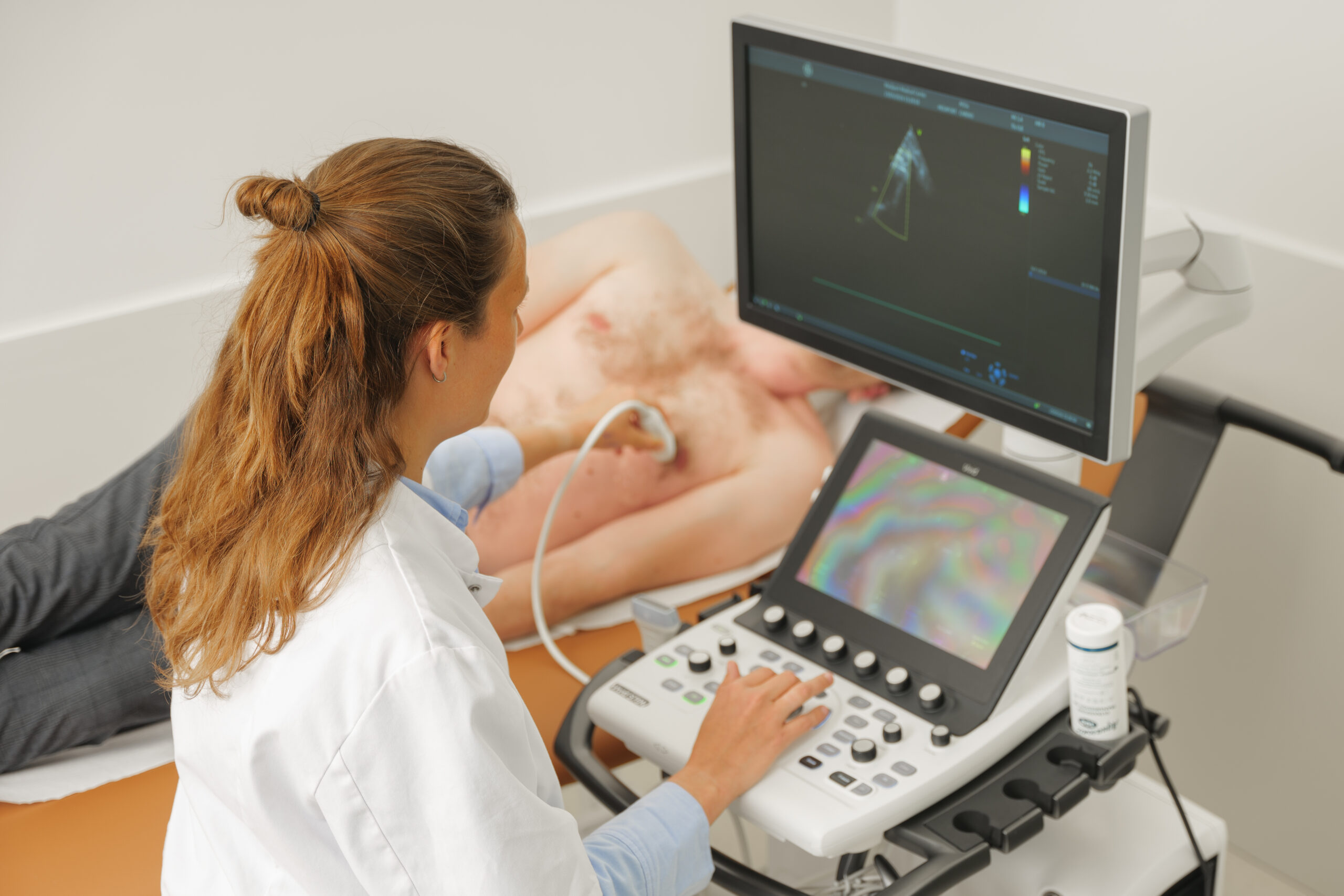 Medical professional performing a routine health check on a patient